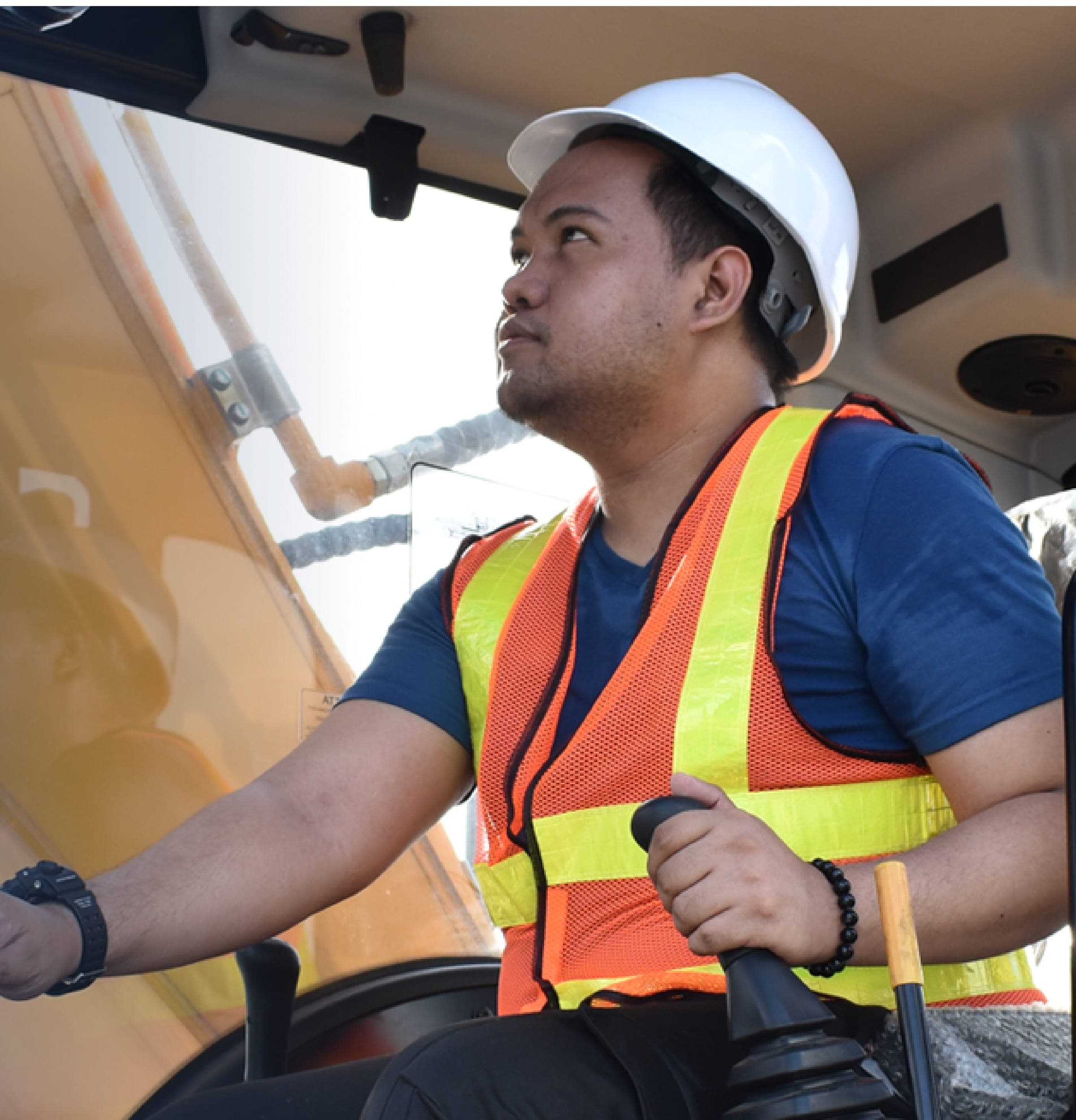 Operator working inside a heavy equipment cab